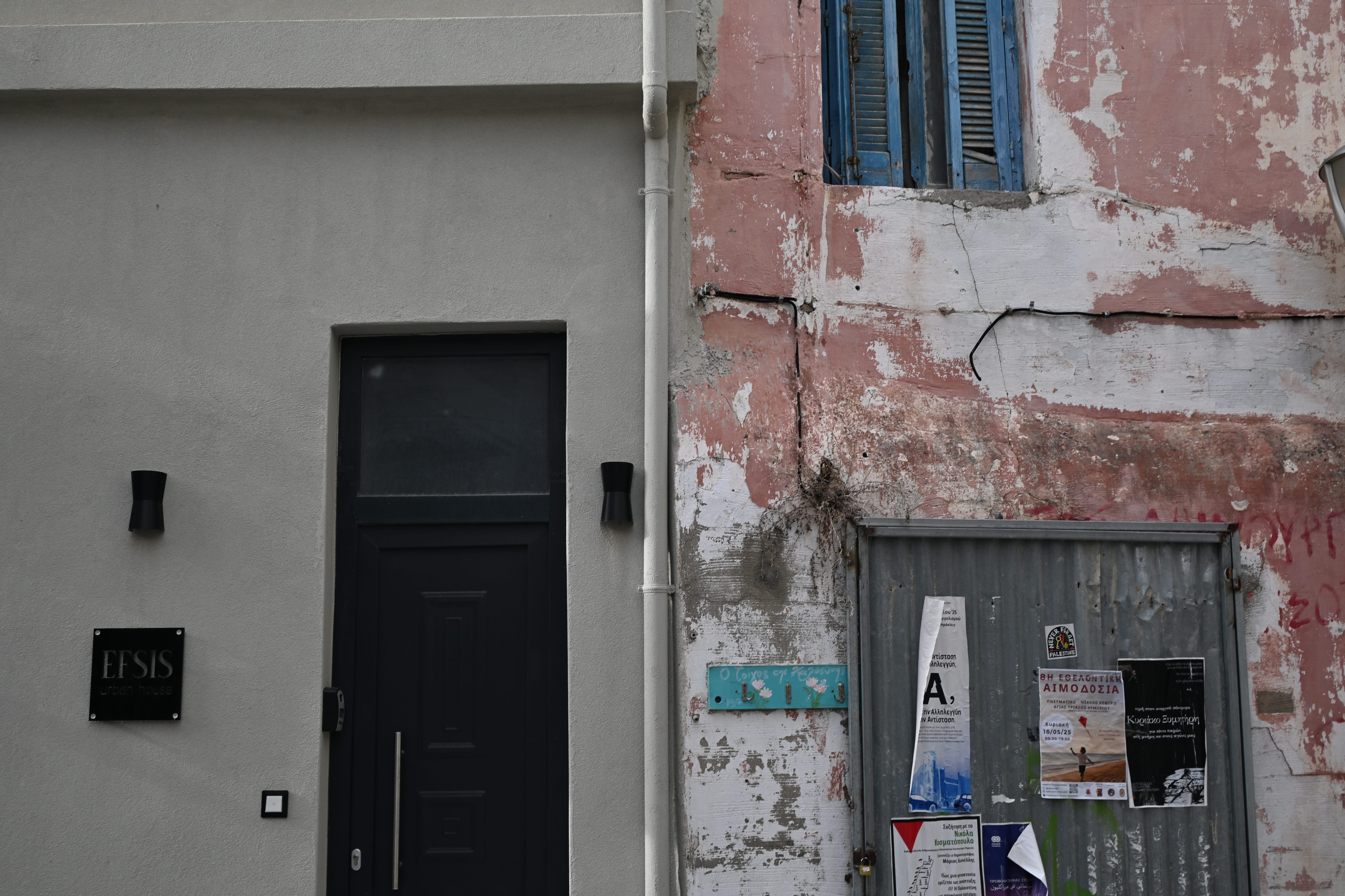Narrow street where traditional architecture meets a freshly painted rental property