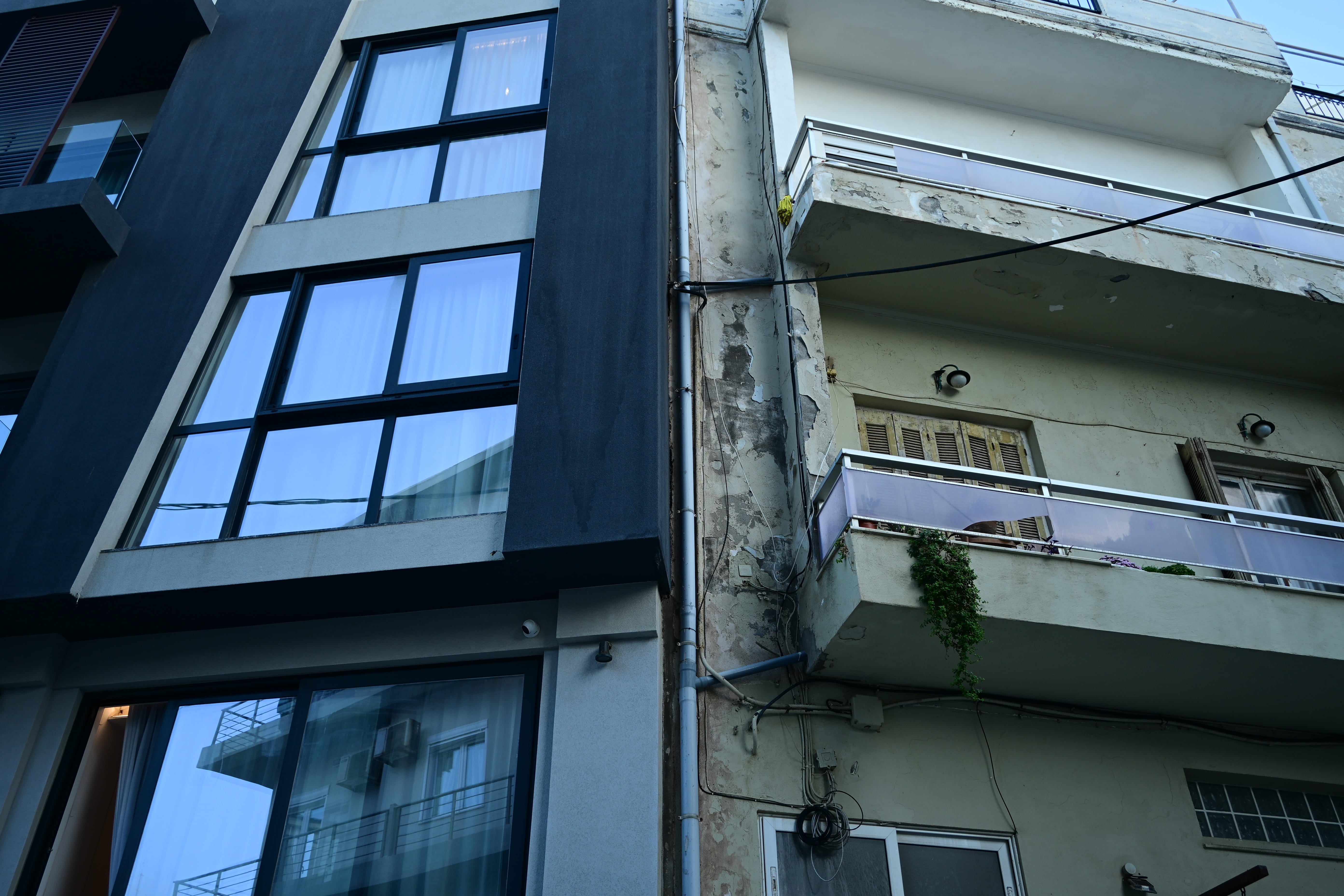 Construction debris piled outside a building being converted into tourist accommodation
